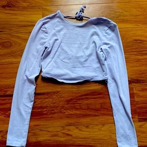 Long sleeve cropped shirt with back cutout. Only worn once
